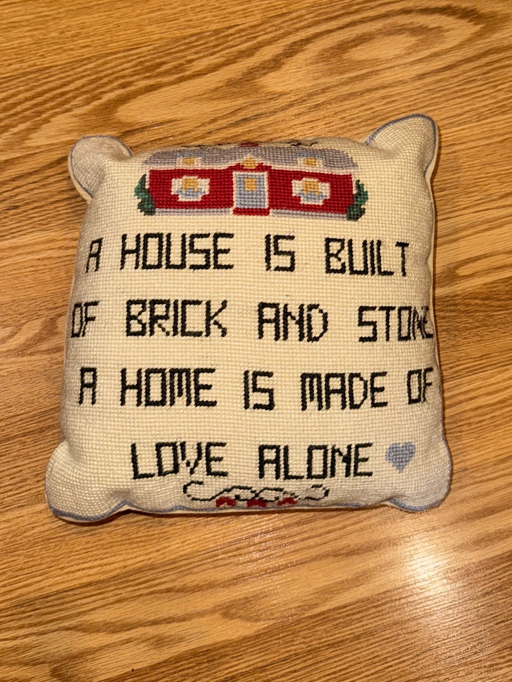 Velvet backed Needlepoint Pillow A House is Built of Brick and Stone